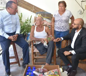 A bird sitting on a nest of eggs.