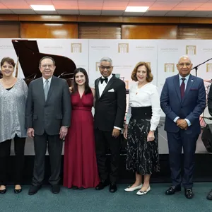 A bird sitting on a nest of eggs.