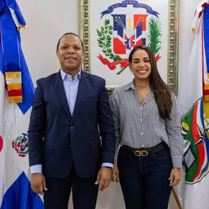 A bird sitting on a nest of eggs.