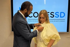 A bird sitting on a nest of eggs.