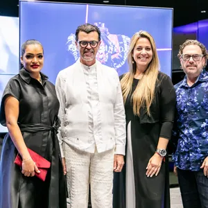 A bird sitting on a nest of eggs.