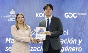 A bird sitting on a nest of eggs.