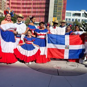 A bird sitting on a nest of eggs.