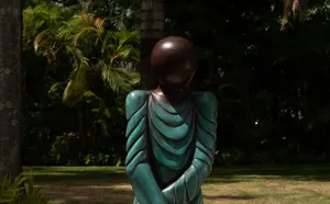 A bird sitting on a nest of eggs.