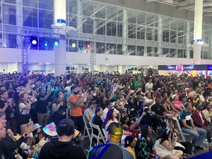 A bird sitting on a nest of eggs.