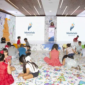 A bird sitting on a nest of eggs.