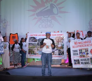 A bird sitting on a nest of eggs.