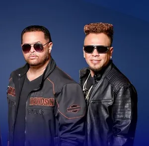 A bird sitting on a nest of eggs.