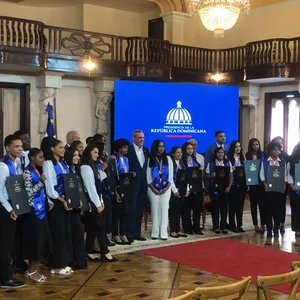 A bird sitting on a nest of eggs.