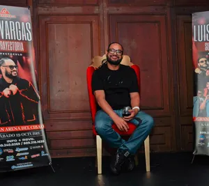 A bird sitting on a nest of eggs.