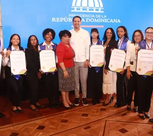 A bird sitting on a nest of eggs.