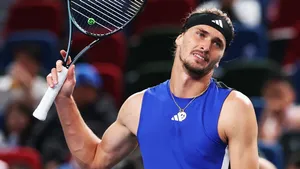 A bird sitting on a nest of eggs.